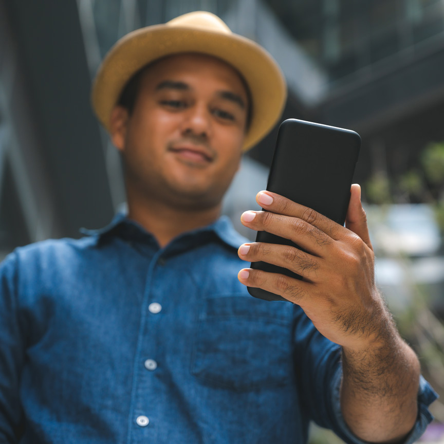 man looking at mobile phone