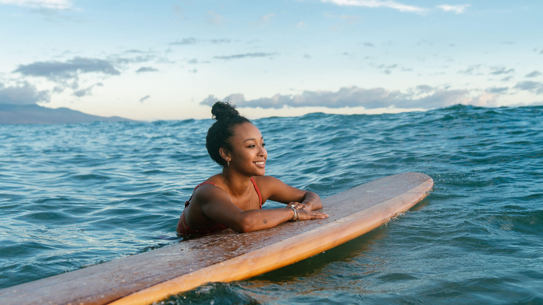 woman floating on surfboard