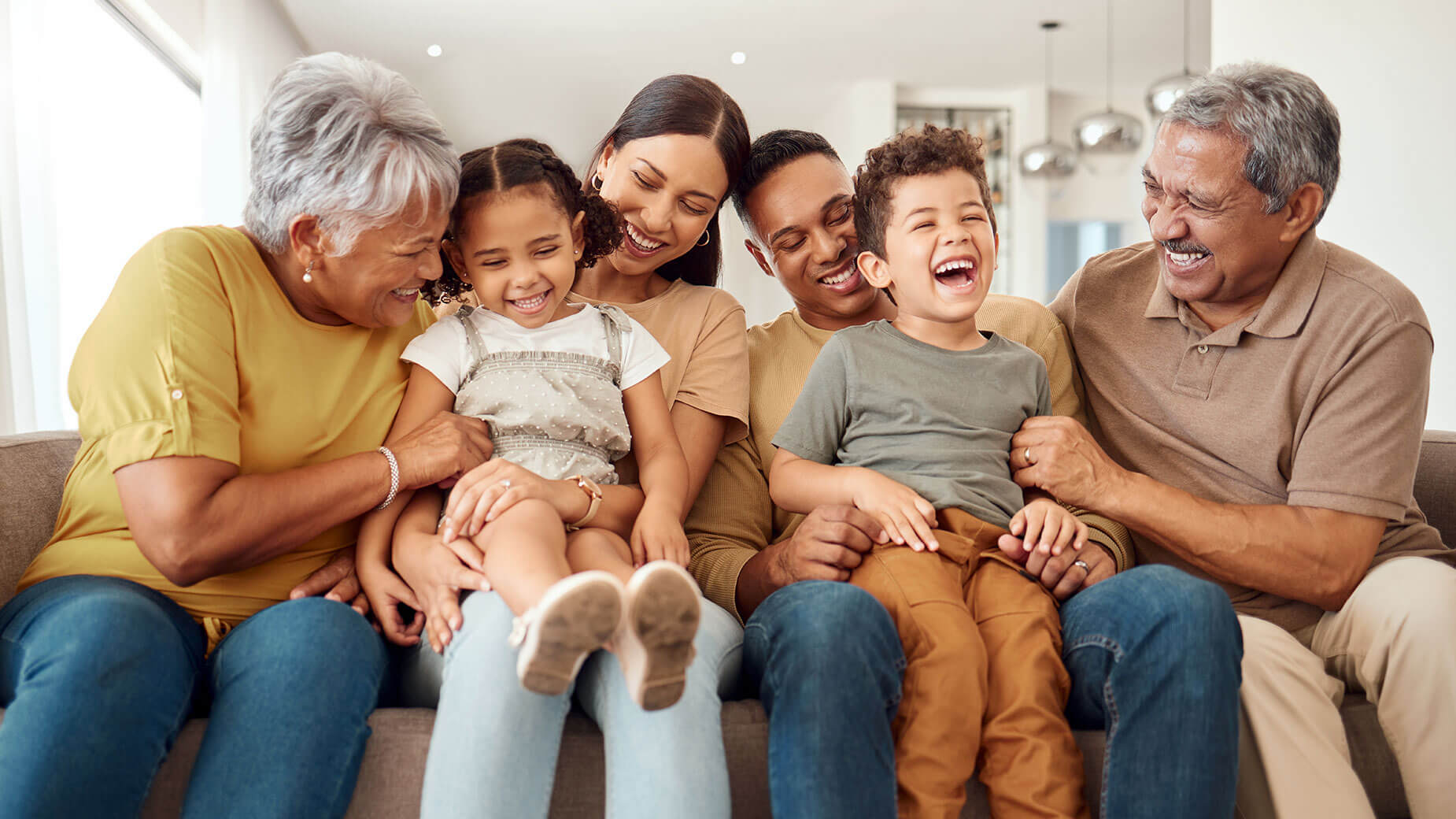 multigeneration family sitting on a couch