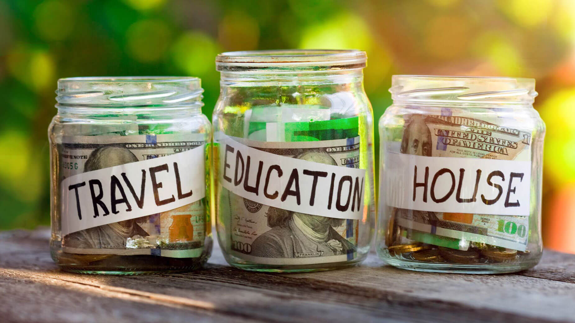 jars of money savings for travel, education and home
