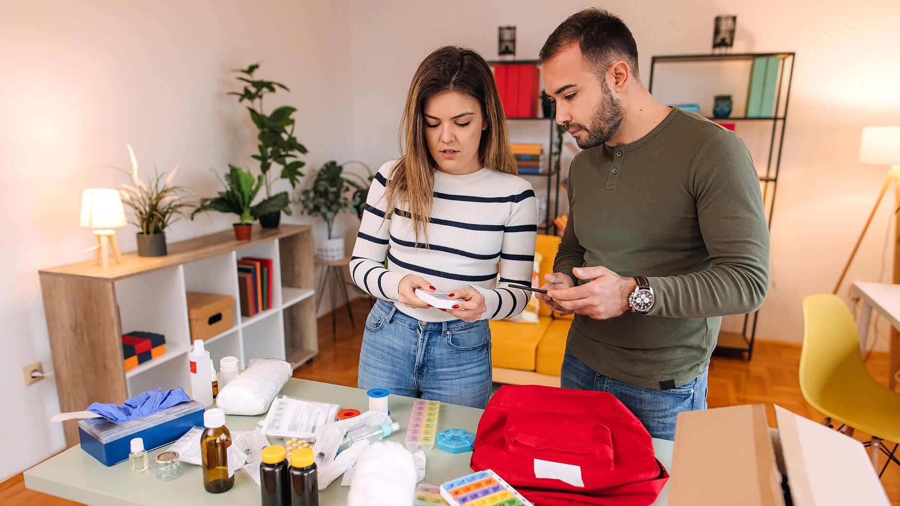 couple making a disaster emergency kit